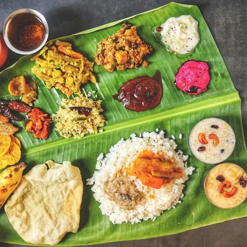 Vibrant South Indian meal on banana leaf