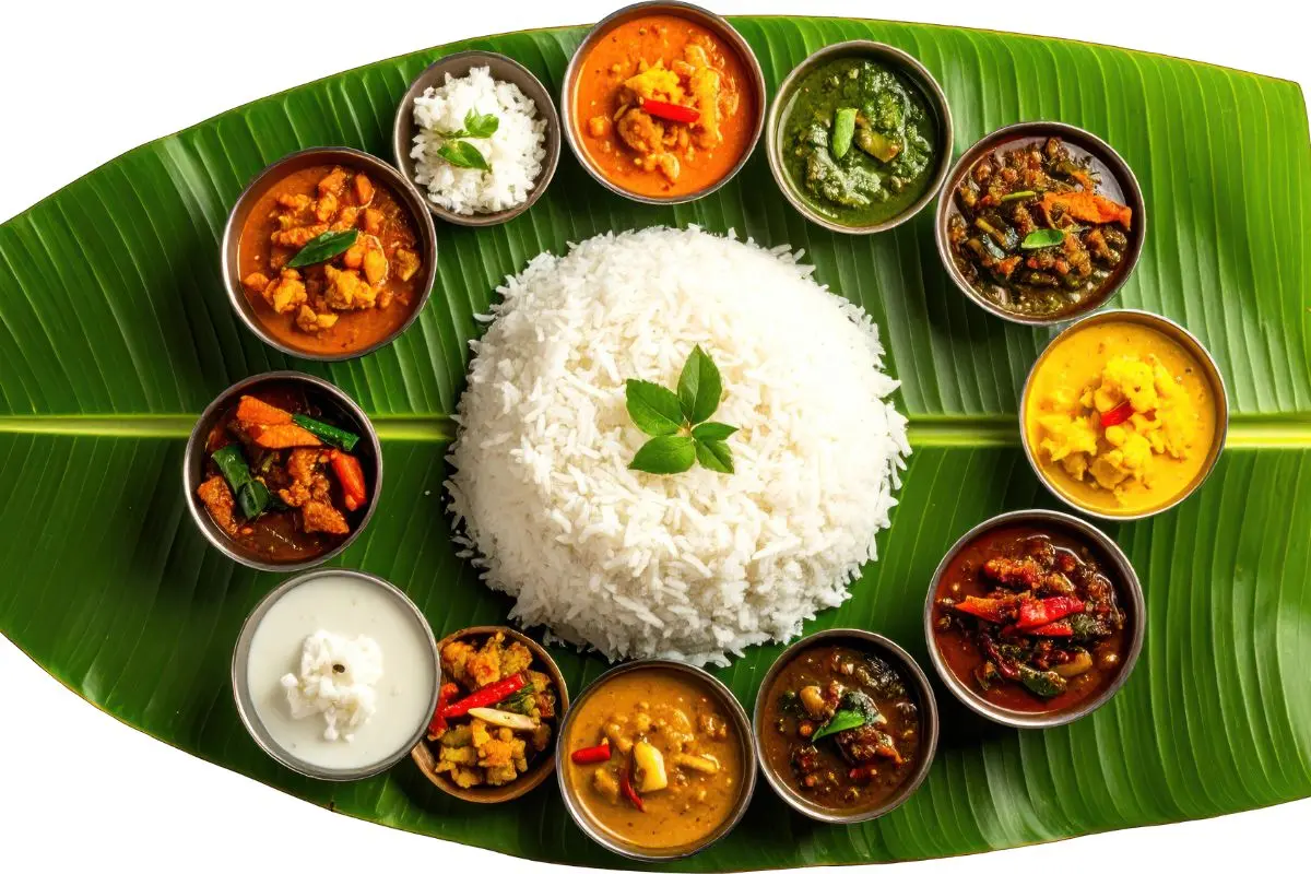 Traditional South Indian vegetarian meals served on a banana leaf with rice, curries, sambar, rasam, poriyal, biryani, payasam and accompaniments by Sri Venkateswara Catering Service (SVR).