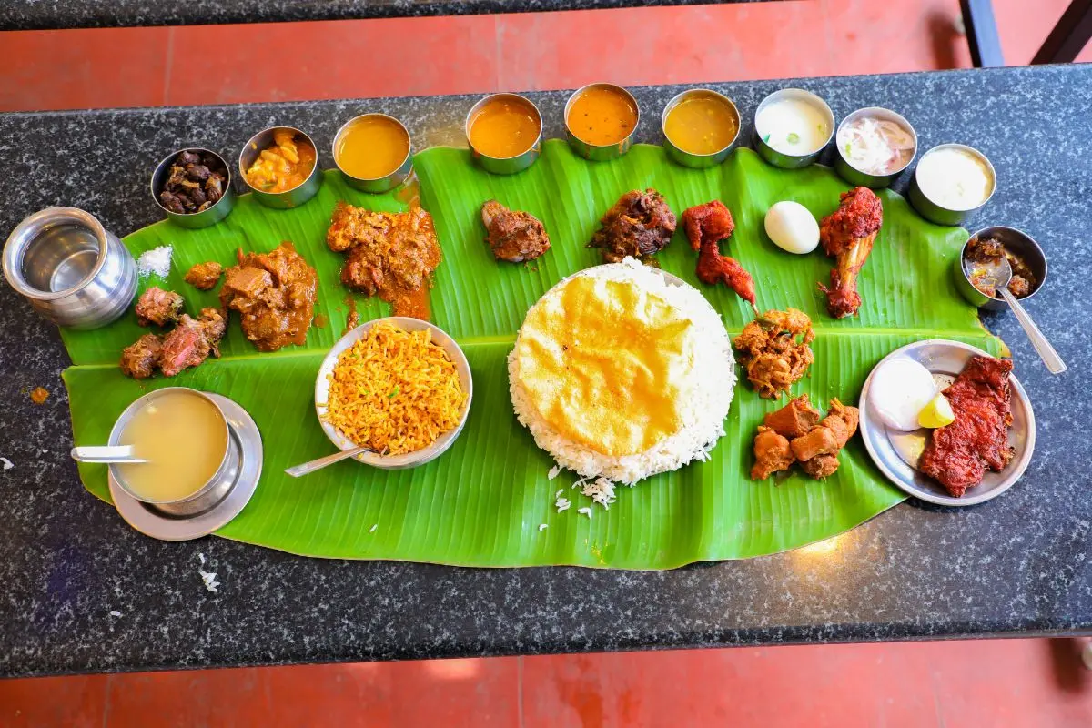 Non-vegetarian South Indian catering by Sri Venkateswara Catering Service, Chennai, featuring chicken and mutton biryani served on banana leaf
