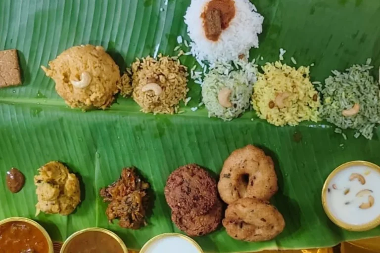 Variety rice and traditional sides on a banana leaf for seemantham and valaikappu catering in Chennai